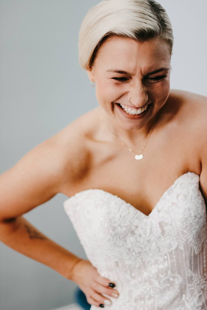 Happy bride smiling in Evolve Salon on her big day